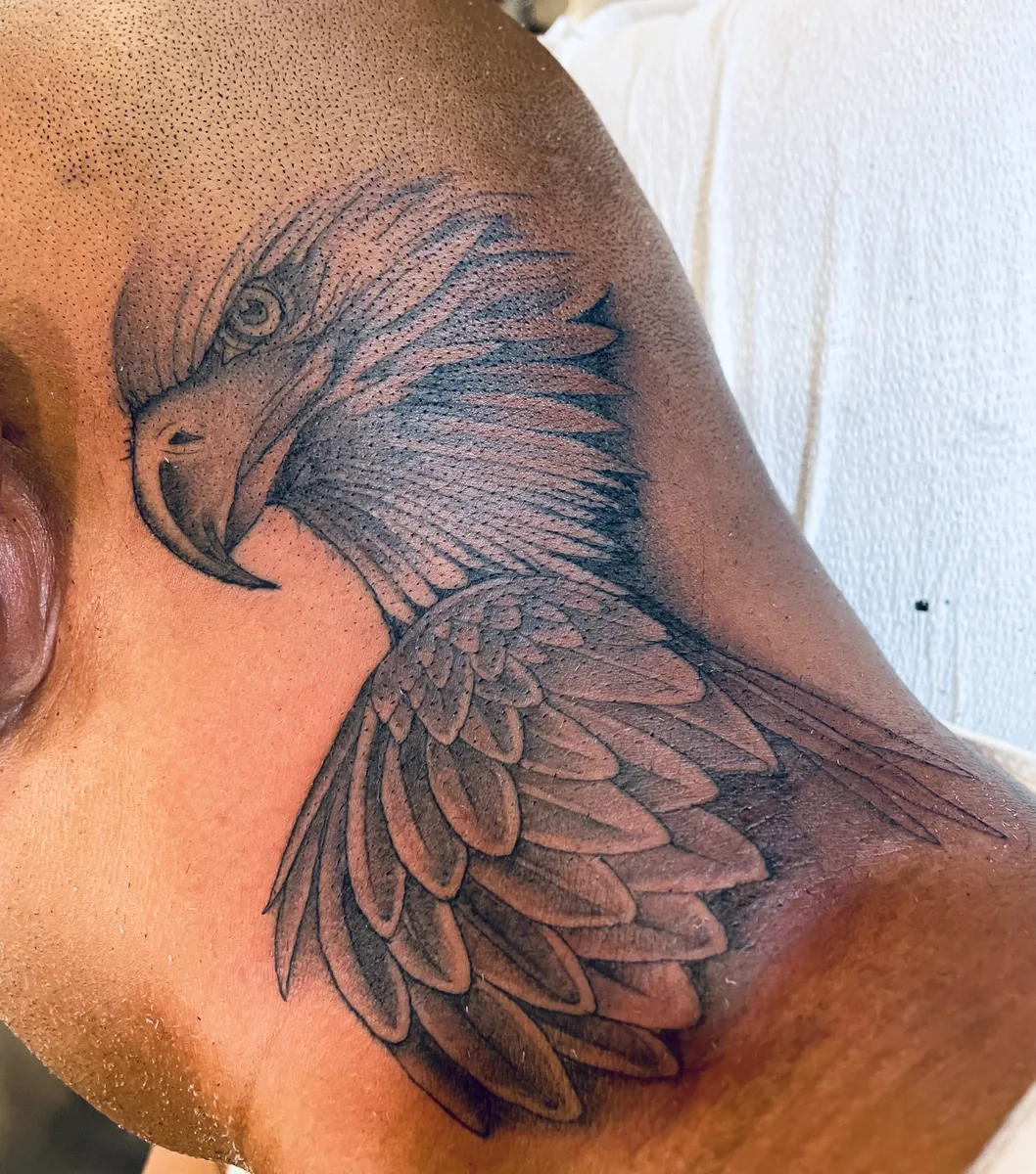 Black and grey eagle neck tattoo with detailed feather work by Josh Espenschied at True North Tattoo in Lancaster, PA