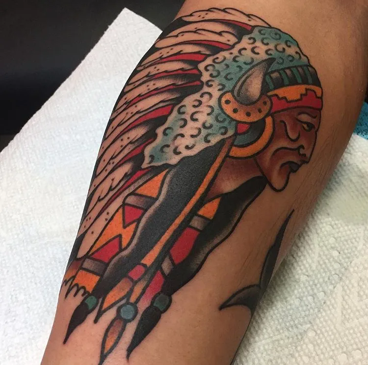 American traditional chief in a feathered headdress, tattooed in bold color on a forearm by Josh Espenschied at True North Tattoo in Lancaster, PA