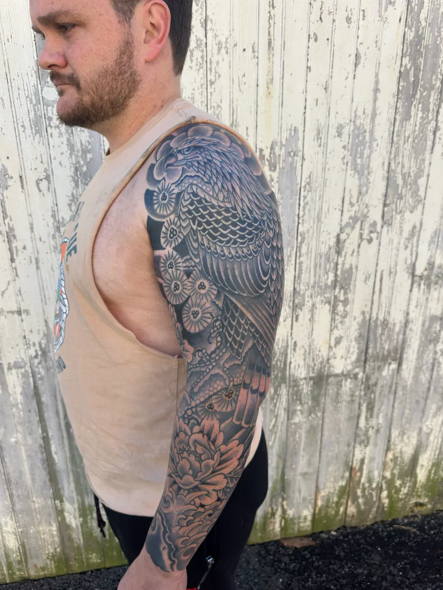 Japanese black and grey eagle and chrysanthemum full sleeve tattoo by Reed Drury at True North Tattoo in Lancaster, PA