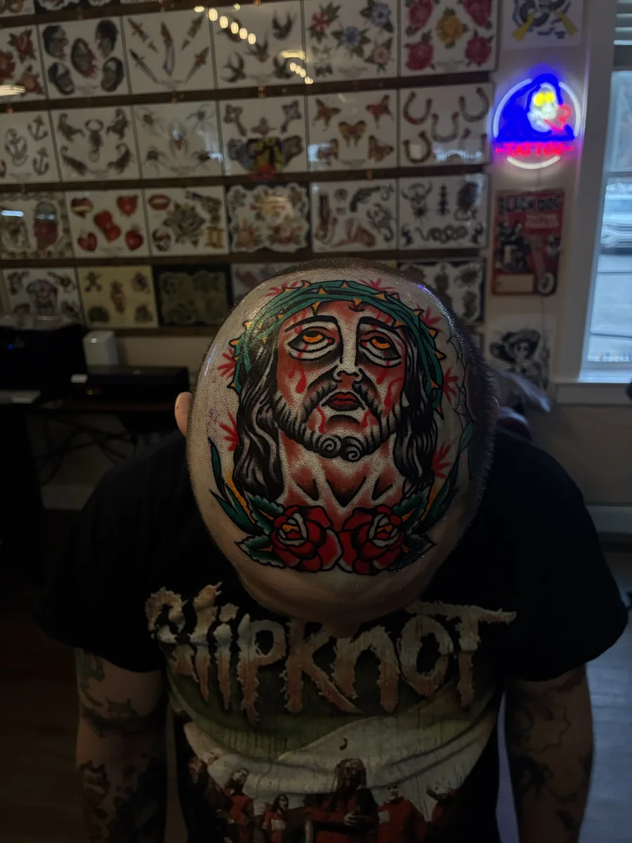Traditional Jesus with a crown of thorns and roses, tattooed on the head by Reed Drury at True North Tattoo in Lancaster, PA